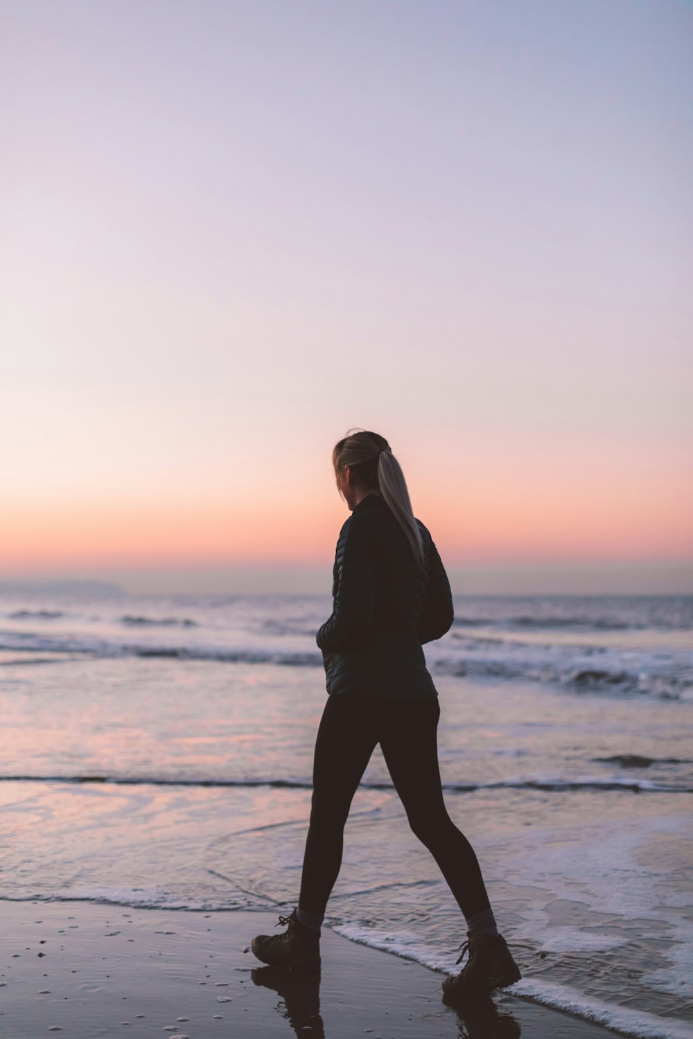 woman about to walk on shoreline