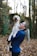 woman carrying dog while standing