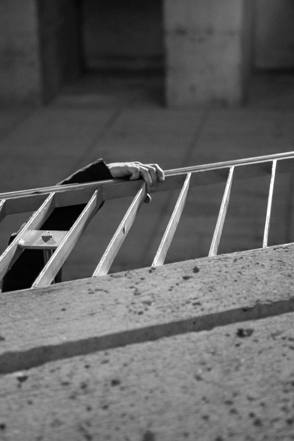 man climbing up the stairs with handrail