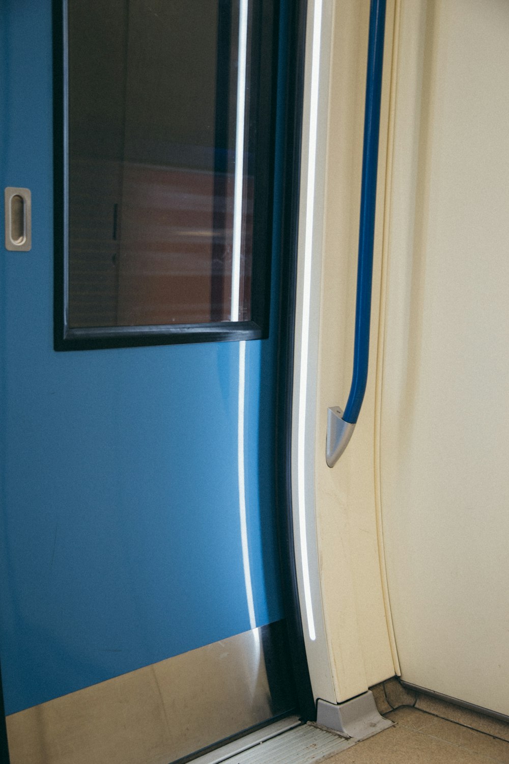 a blue and white door with a window