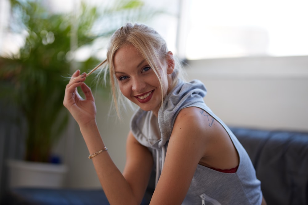 woman smiling sitting on sofa