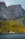 mountain covered by green grass during daytime