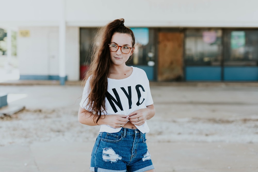 smiling woman standing near store