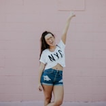 smiling woman doing peace sign