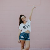 smiling woman doing peace sign