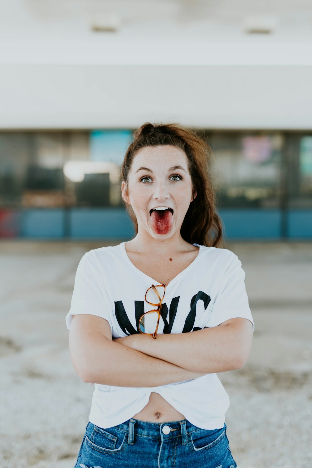 woman making face wearing white shirt