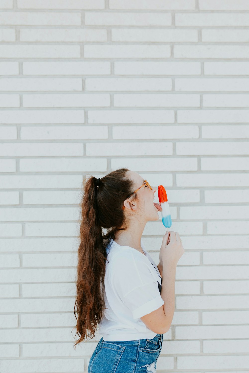 woman licking ice cream