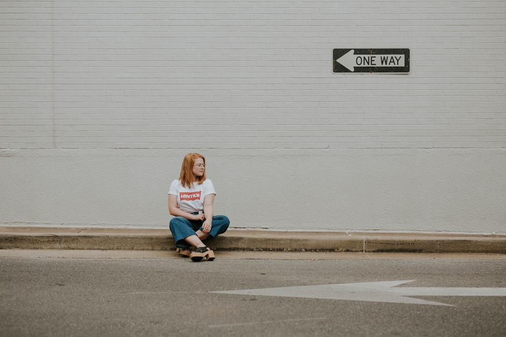 woman sitting on raod