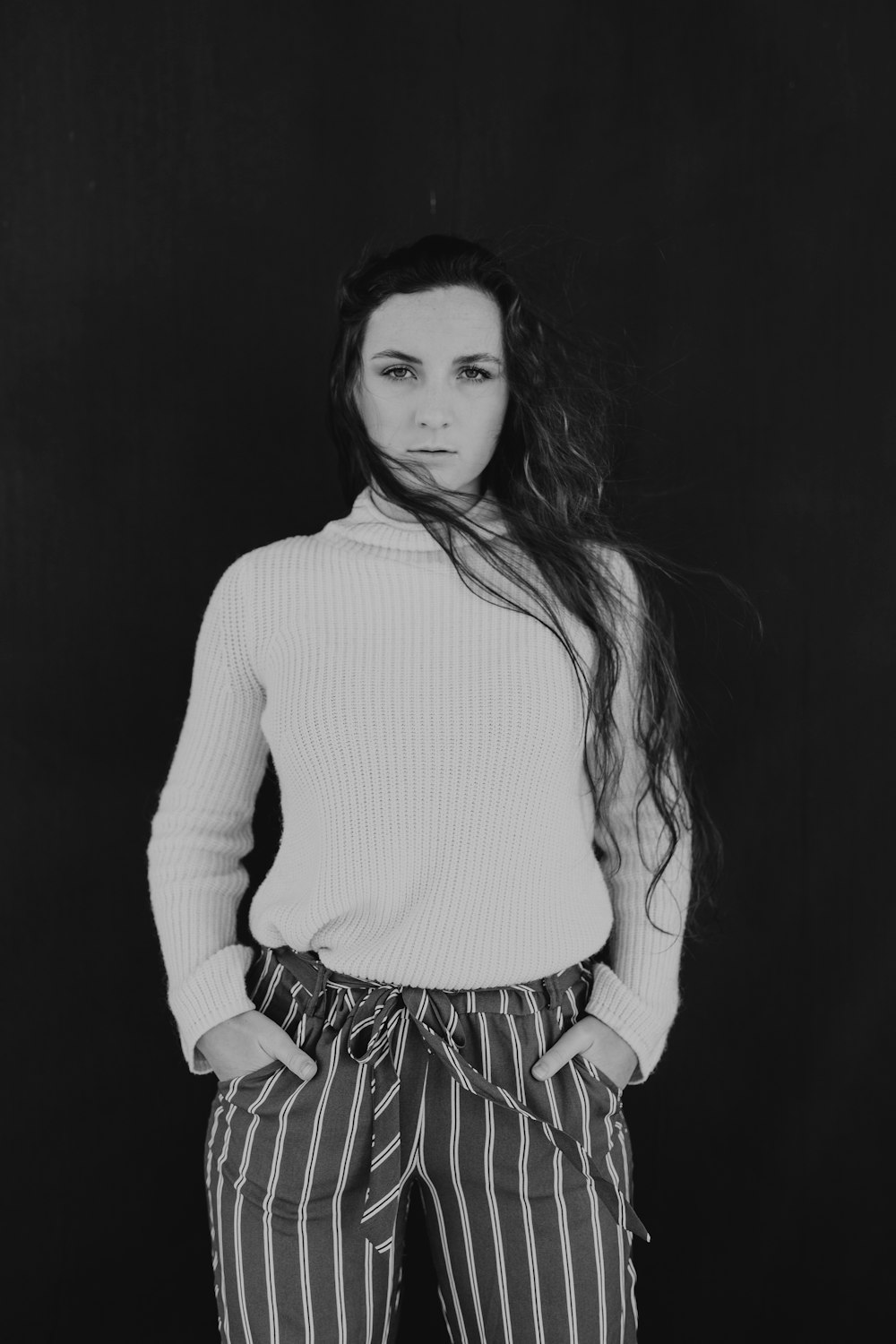 grayscale photography of woman wearing sweatshirt