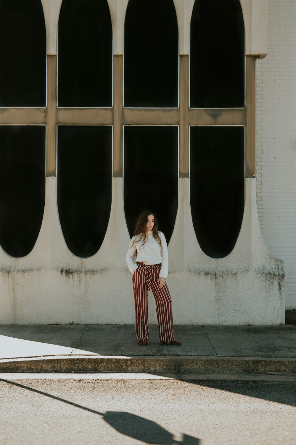 woman standing near building