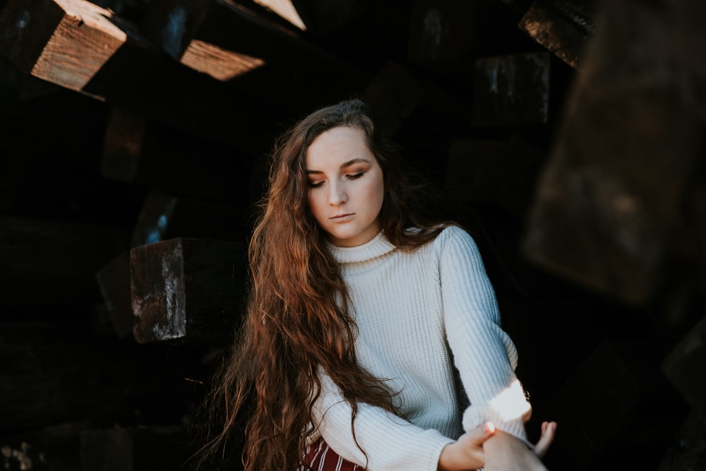 woman wearing white sweater