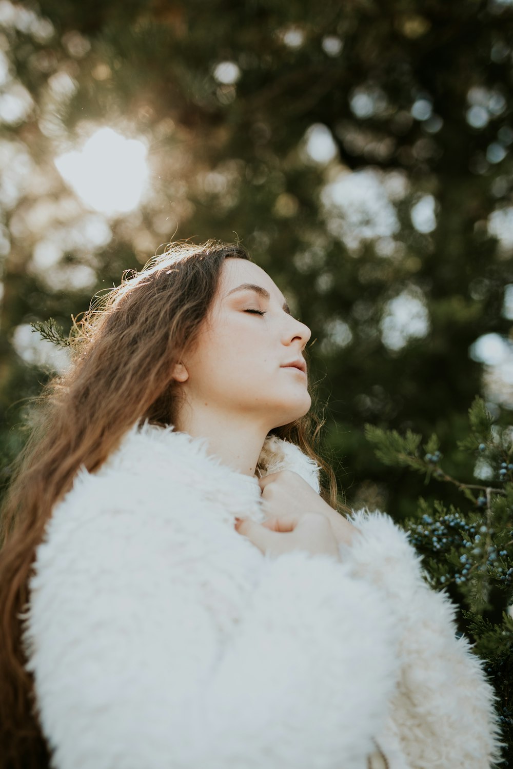 woman wearing white fur coat