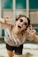 selective focus photography of jolly woman using peace hand gesture
