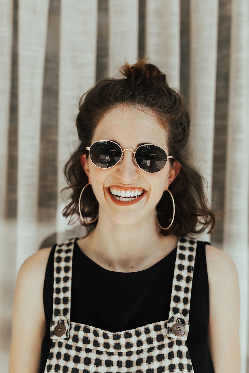 woman wearing white and black rompers and black top