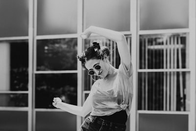 grayscale photo of woman wearing sunglasses playful zoom background