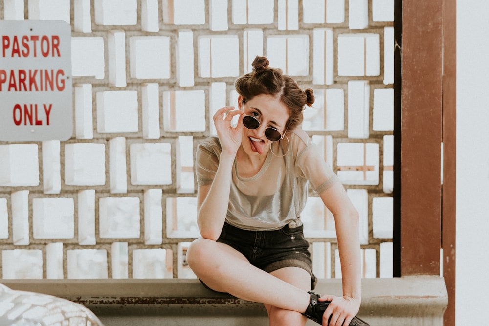 woman holding sunglasses