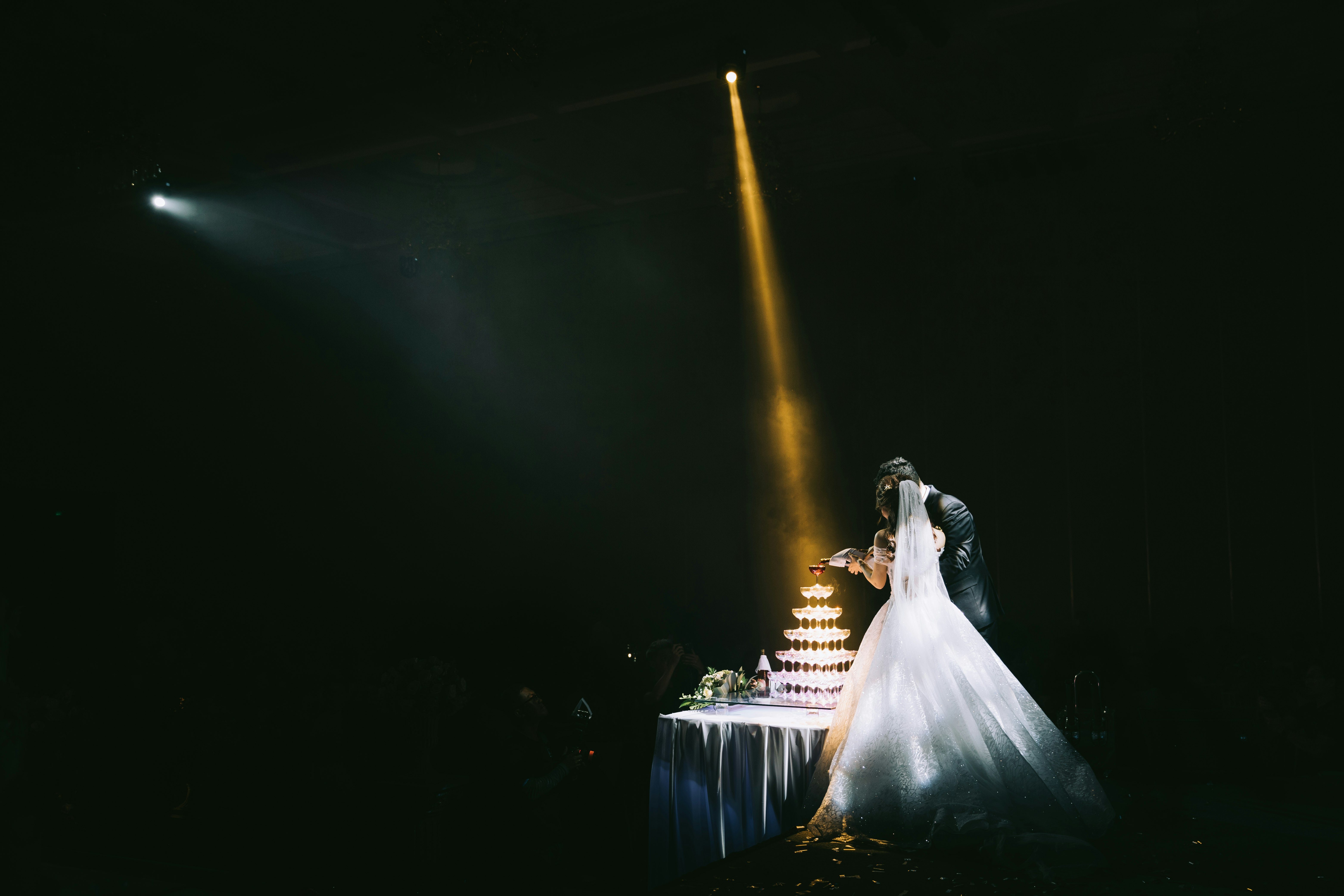 bride and groom standing beside taqble