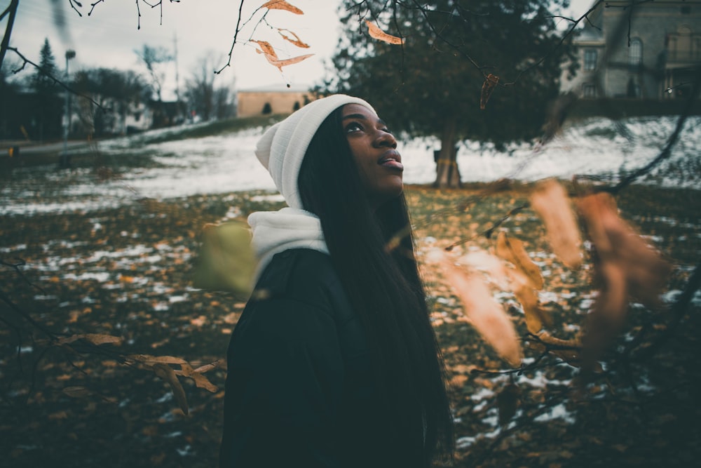 woman standing near tree during daytime