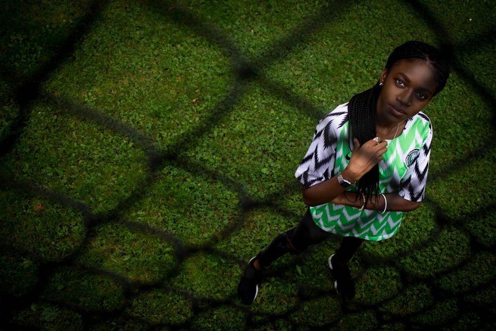 women standing on green lawn