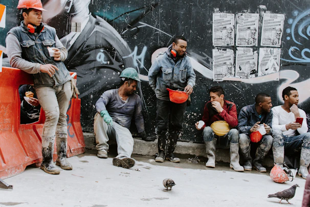 Textile workers sharing a moment of camaraderie during a break.