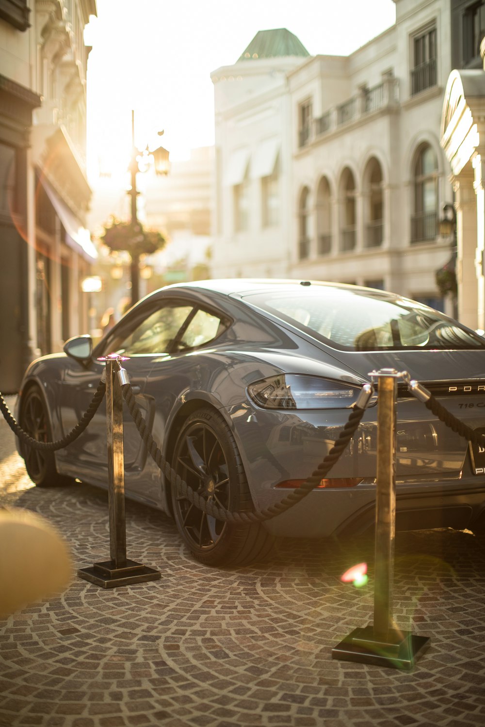 gray coupe parking near building