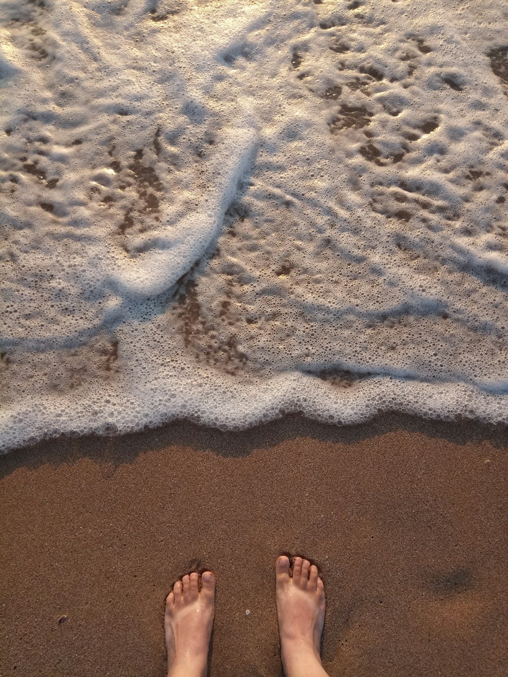 person standing on shoreline