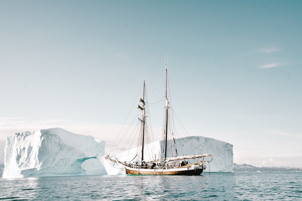 boat approaching iceberg