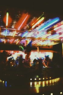 a blurry photo of a carnival ride at night