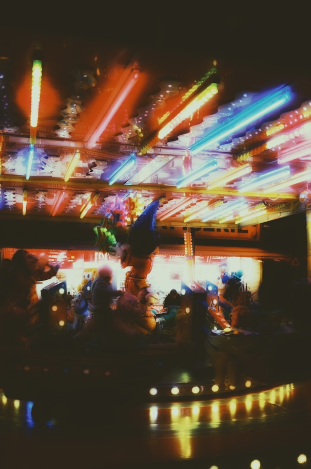 a blurry photo of a carnival ride at night