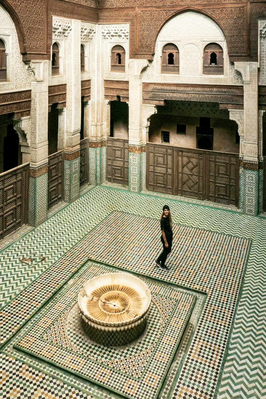 marble floor acnh, marble floor, a person standing in a room with a fountain