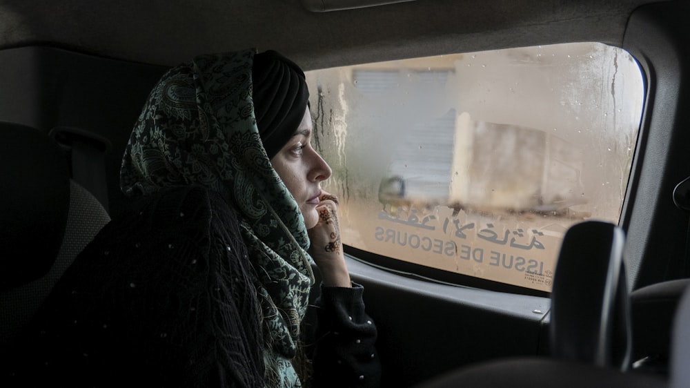 woman sitting inside car