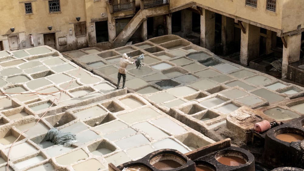 person standing grey concrete structure