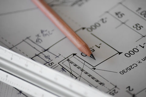 Engineer marking technical drawing