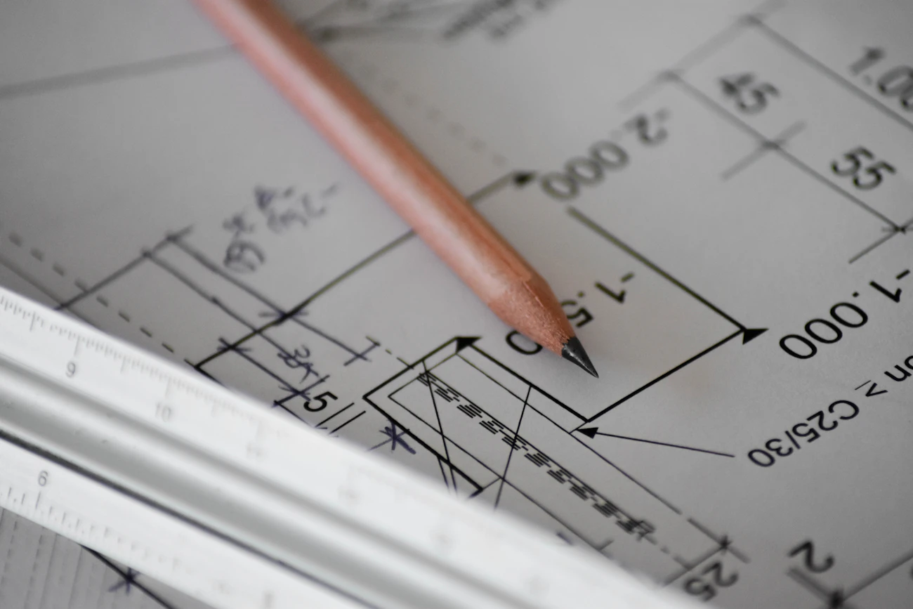 Architectural model and planning materials on a design table