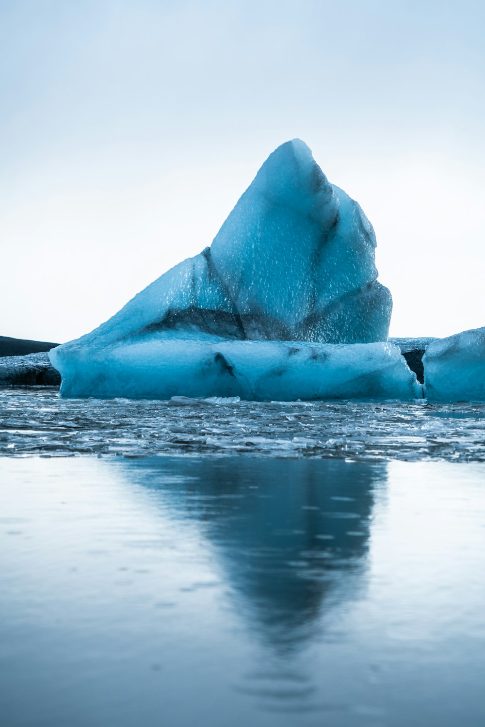 glacier on sea during daytime