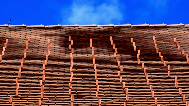 Newly installed roof with neat rows of tiles on a charming house in Fécamp.