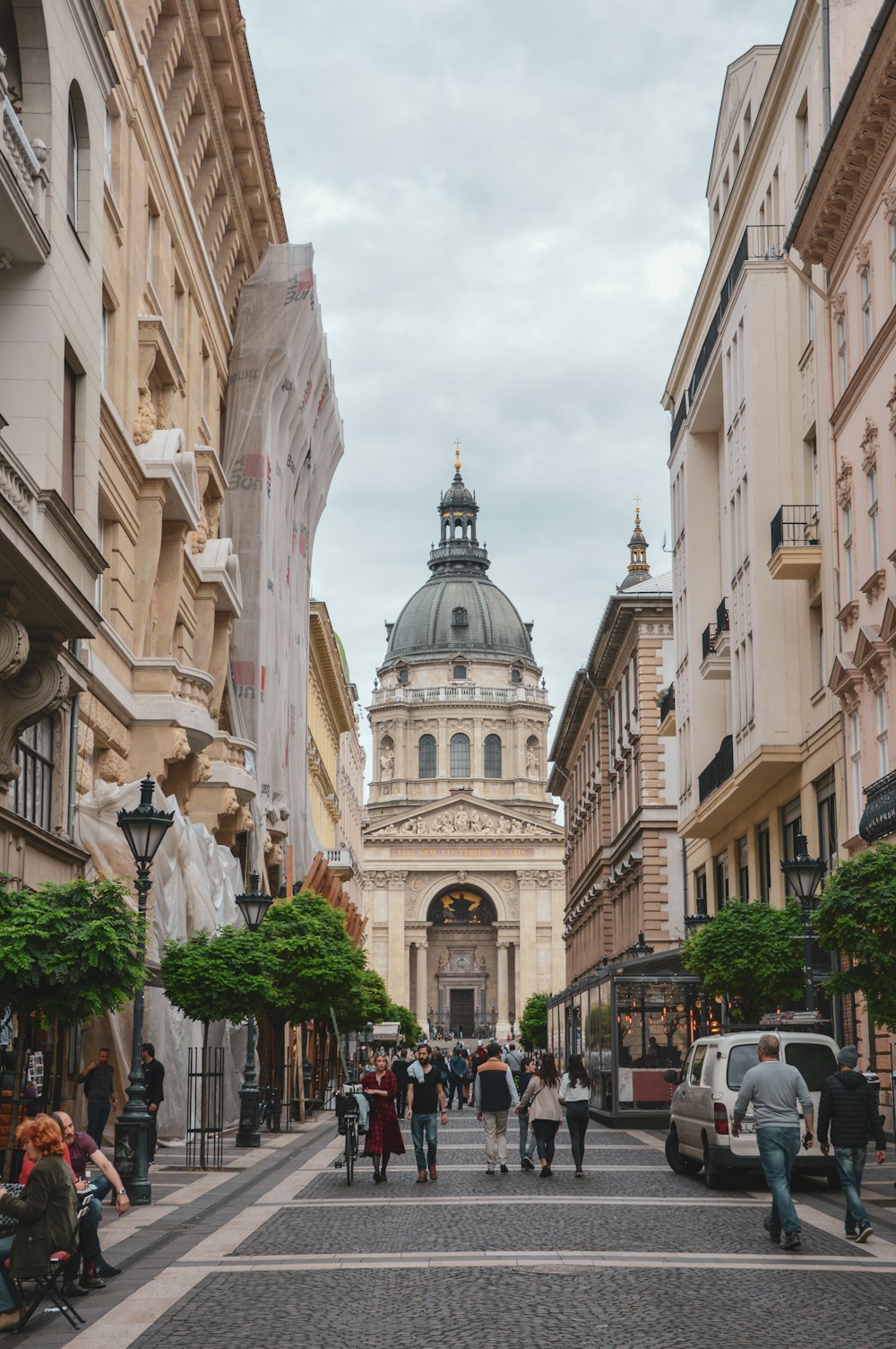 people walking on street in front of cathedral during daytime