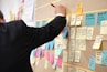 sticky notes on corkboard