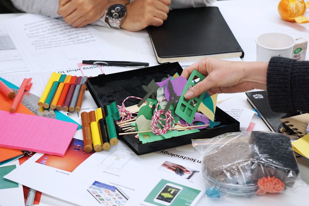 person holding paper cutout decors