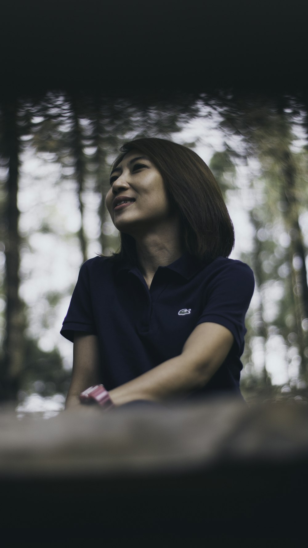 selective focus photography of woman near trees