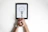 Focused man reviewing a professional freelance proposal on his tablet.