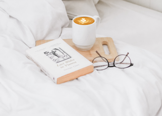 coffee in ceramic mug served on board