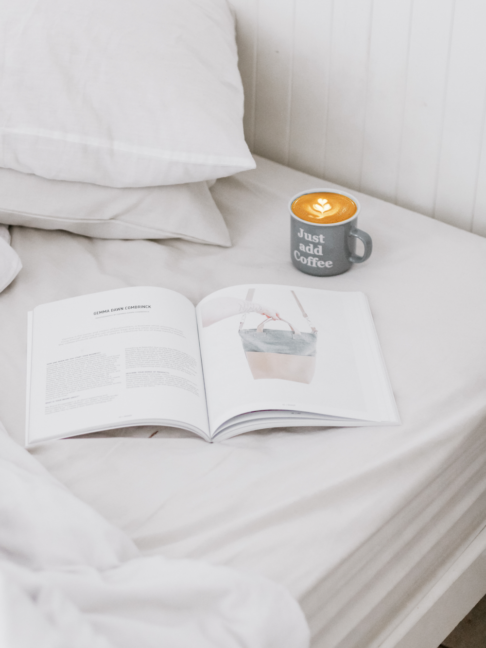 ceramic mug beside opened book