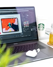 turned on MacBook Pro displaying music