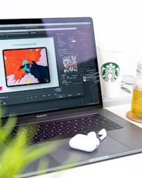 turned on MacBook Pro displaying music