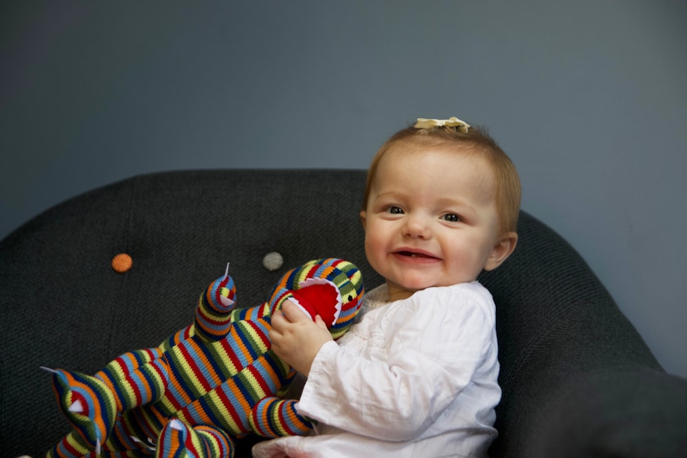 baby siting on chair