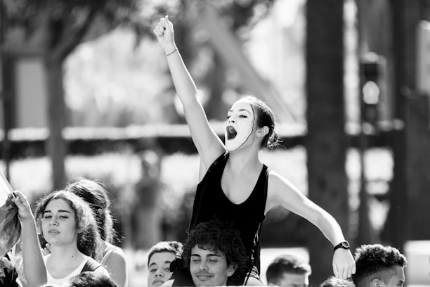woman raising right hand