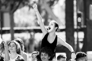 woman raising right hand