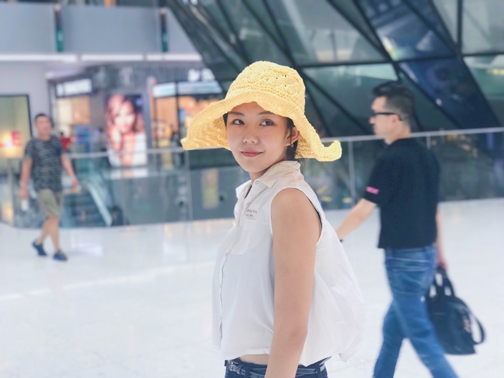 woman wearing yellow bucket hat