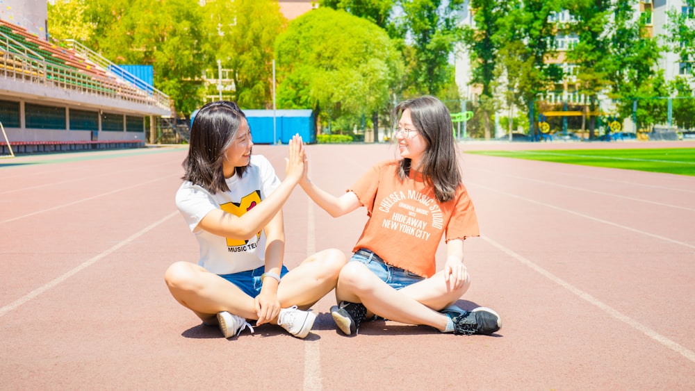 two women doing high five